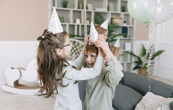 Two kids enjoying birthday party