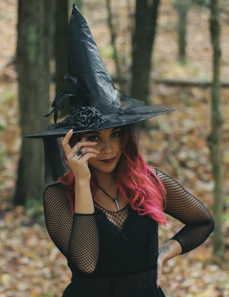 Woman with witch costume for Halloween party