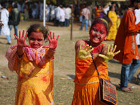 Two little girls enjoying Holi at Shantiniketan
