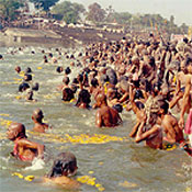 ceremonial dip in the water at Kumbh Mela