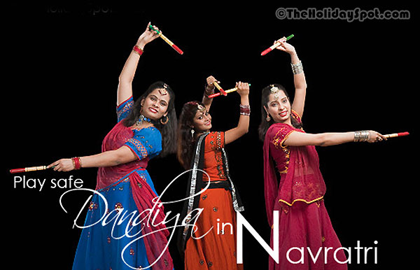 Navratri card for WhatsApp and Facebook with the background of three women playing Dandiya