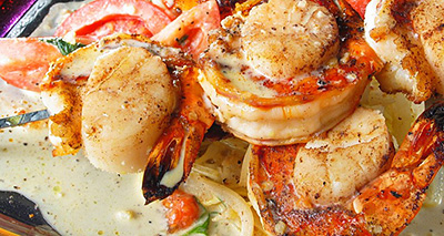 Seafood Brochettes with Tomato-Basil Champagne  Sauce